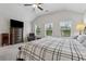 Bright main bedroom boasting an upholstered bed, carpet floors, and windows providing lots of natural light at 48 Lantern Trce, Hiram, GA 30141