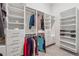 Large walk-in closet with built-in shelving, drawers, and rods providing ample storage space at 48 Lantern Trce, Hiram, GA 30141