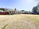 Wide backyard view of the home and the fenced yard at 5710 Stephens Mill Dr, Sugar Hill, GA 30518