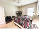 Bedroom featuring carpet floors, ceiling fan, and natural light at 5710 Stephens Mill Dr, Sugar Hill, GA 30518