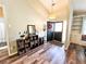 Welcoming foyer with hardwood floors, built-in shelves, and stylish decor at 5710 Stephens Mill Dr, Sugar Hill, GA 30518