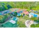 Aerial view of community amenities including a pool, and tennis courts at 708 Players Ct, Woodstock, GA 30189