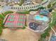 Aerial view featuring tennis courts, swimming pool and playground in suburban neighborhood at 708 Players Ct, Woodstock, GA 30189