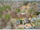 Aerial view of a home backing up to a wooded area and golf course at 708 Players Ct, Woodstock, GA 30189