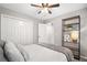 Cozy bedroom featuring decorative shelving and a ceiling fan at 708 Players Ct, Woodstock, GA 30189