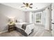 This secondary bedroom has neutral walls, and lots of light from the window at 708 Players Ct, Woodstock, GA 30189