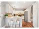 Beautiful kitchen with granite countertops, stainless steel appliances, and a view of the stairway at 708 Players Ct, Woodstock, GA 30189