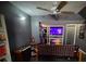 Entertainment room with arcade games, large TV, and ceiling fan at 805 Wayside Dr, Lawrenceville, GA 30046