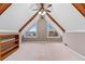 Attic living space features vaulted ceiling, wooden beams, and built-in shelving at 3222 Bay View Dr, Jonesboro, GA 30236