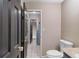 Bathroom featuring white tile, marble vanity, and black doors at 3222 Bay View Dr, Jonesboro, GA 30236