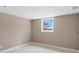 Bedroom with tiled floors, tan walls, recessed lighting, and a single window letting in natural light at 3222 Bay View Dr, Jonesboro, GA 30236