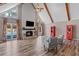 Bright living room featuring vaulted ceilings, fireplace, and view of the swimming pool at 3222 Bay View Dr, Jonesboro, GA 30236