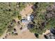 Bird's-eye view of the property, showing the house layout, driveway, and surrounding trees and land at 5245 Emmett Still Rd, Loganville, GA 30052