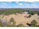 Expansive aerial view of a lush, wooded property showcasing its large land and secluded setting at 5245 Emmett Still Rd, Loganville, GA 30052