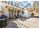 Stone patio features outdoor kitchen area, stone planters and several entry doors to the house at 5245 Emmett Still Rd, Loganville, GA 30052