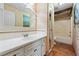 Bathroom featuring light color tile and cabinets, with classic style and design at 5245 Emmett Still Rd, Loganville, GA 30052