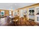 Elegant dining area with hardwood floors, built-in shelving, and an open layout perfect for entertaining guests at 5245 Emmett Still Rd, Loganville, GA 30052