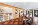 Dining room features hardwood floors, built-in cabinets, and windows, creating a warm and inviting space at 5245 Emmett Still Rd, Loganville, GA 30052