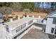 Spacious rooftop terrace with iron railings overlooking the property, offering ample space for entertaining at 5245 Emmett Still Rd, Loganville, GA 30052