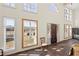 Bright foyer with large windows highlighting outdoor views and a grand entrance door at 5245 Emmett Still Rd, Loganville, GA 30052