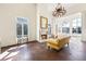 This living room features tall ceilings, fireplace, chandelier, and tons of natural light at 5245 Emmett Still Rd, Loganville, GA 30052