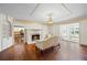 Bright living room with hardwood floors, fireplace, and detailed ceiling at 5245 Emmett Still Rd, Loganville, GA 30052