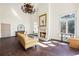 Living room featuring a fireplace, chandelier, and several windows, allowing tons of natural light at 5245 Emmett Still Rd, Loganville, GA 30052