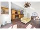 Spacious living room with hardwood floors, columns, chandelier, and fireplace, creating a warm and inviting atmosphere at 5245 Emmett Still Rd, Loganville, GA 30052