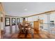 Second-story sitting area with hardwood floors, natural light, chandelier, and an open railing overlooking the lower level at 5245 Emmett Still Rd, Loganville, GA 30052