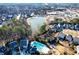 A scenic aerial view of the community showing the pool, lake, playground, and surrounding homes at 167 Marlow Dr, Woodstock, GA 30188
