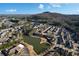 An aerial view shows the community with a serene lake, well-maintained landscaping, and neighborhood amenities at 167 Marlow Dr, Woodstock, GA 30188