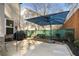 This backyard offers a patio with seating and a grill, perfect for outdoor entertaining at 167 Marlow Dr, Woodstock, GA 30188