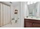 This bathroom features a toilet and a vanity with a sink, all in a neutral color scheme at 167 Marlow Dr, Woodstock, GA 30188