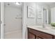Well-lit bathroom with dark wood vanity cabinet, white countertops, and a separate toilet area at 167 Marlow Dr, Woodstock, GA 30188