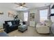 Comfortable bonus room with a sofa, exercise equipment, and ample natural light at 167 Marlow Dr, Woodstock, GA 30188