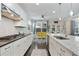 Well-appointed kitchen with white cabinets, stainless steel appliances, and a breakfast nook at 167 Marlow Dr, Woodstock, GA 30188