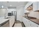 Modern kitchen with stainless steel appliances, granite countertops, and custom cabinetry at 167 Marlow Dr, Woodstock, GA 30188