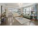 Open-concept living room with hardwood floors and plenty of natural light at 167 Marlow Dr, Woodstock, GA 30188