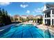 A sparkling community pool set against a backdrop of elegant homes and manicured landscaping at 167 Marlow Dr, Woodstock, GA 30188