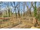 Wooden back deck overlooking a yard with mature trees at 1988 Boulderview Se Dr, Atlanta, GA 30316