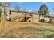 Spacious backyard with a deck, stairs, and ample green space at 1988 Boulderview Se Dr, Atlanta, GA 30316