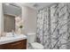 Stylish bathroom featuring a modern vanity and a trendy marble-patterned shower curtain at 1988 Boulderview Se Dr, Atlanta, GA 30316