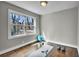 Sun-filled bedroom featuring hardwood floors, a large window, yoga mat, and exercise equipment at 1988 Boulderview Se Dr, Atlanta, GA 30316