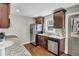 Kitchen featuring granite counters, stainless steel appliances, and dark wood cabinets at 1988 Boulderview Se Dr, Atlanta, GA 30316