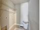 Well-lit laundry room with ample storage shelves and space for laundry basket and a white shag rug at 1988 Boulderview Se Dr, Atlanta, GA 30316