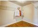 Spacious walk-in closet with hanging racks and wood floors offers plenty of storage space at 1988 Boulderview Se Dr, Atlanta, GA 30316