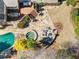 Aerial view showcases backyard oasis: pool, hot tub, stone patio, deck, and lush landscaping for ultimate relaxation at 2146 Wolbert Trl, Marietta, GA 30062