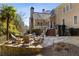 Beautiful backyard featuring a stone patio, a cozy fire pit with outdoor seating, and manicured landscaping at 2146 Wolbert Trl, Marietta, GA 30062