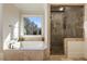 Bathroom featuring a jacuzzi tub, framed window with a view, and glass-enclosed shower at 2146 Wolbert Trl, Marietta, GA 30062