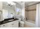 Bright bathroom featuring a marble vanity, shower/tub combo, and tiled floors at 2146 Wolbert Trl, Marietta, GA 30062